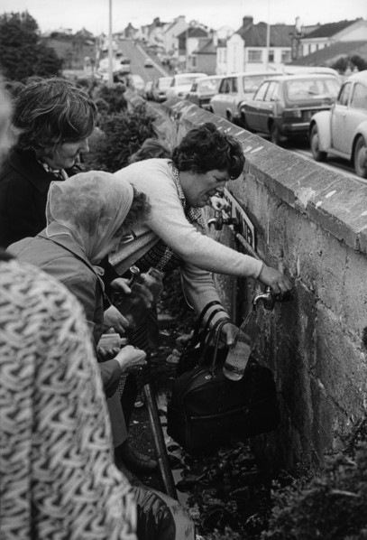 Filling up with holy water, Knock, County Mayo