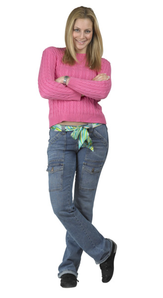 A young woman standing with her arms folded.