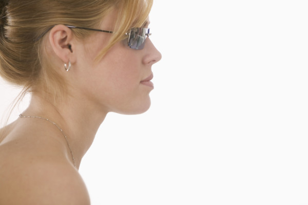 Profile of woman wearing sunglasses.