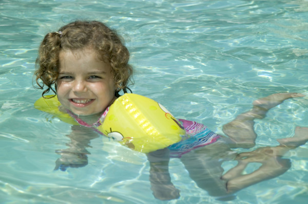 Little girl swimming.
