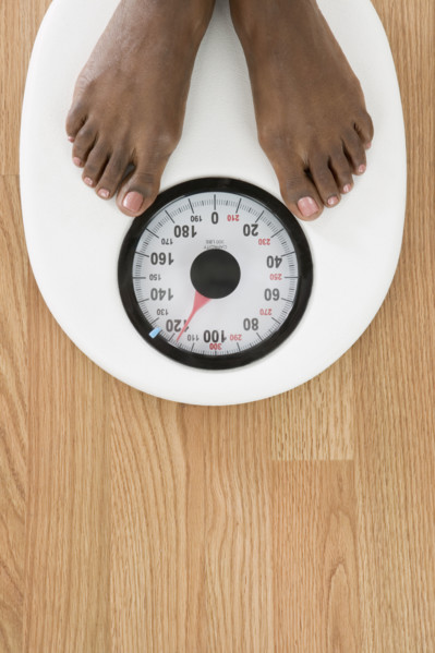 Feet on a scale as seen from overhead.