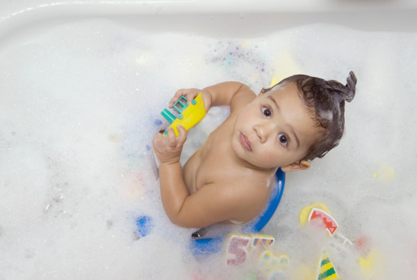 Looking down at a baby bathing.