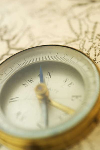 Closeup of a map and compass.
