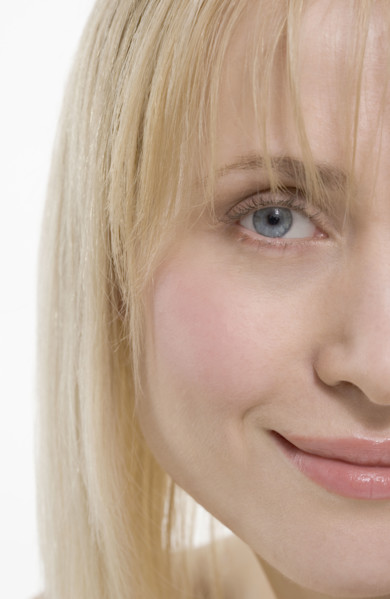 Partial view of smiling woman's face.