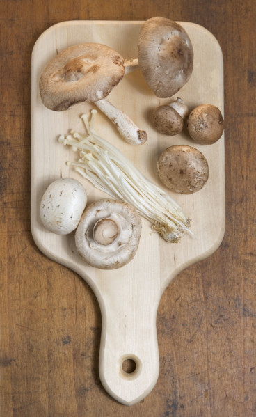 Mushrooms on cutting board.