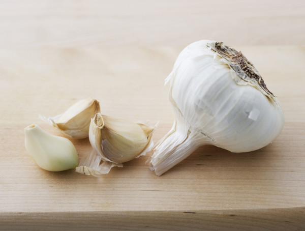 Closeup of garlic head and cloves.