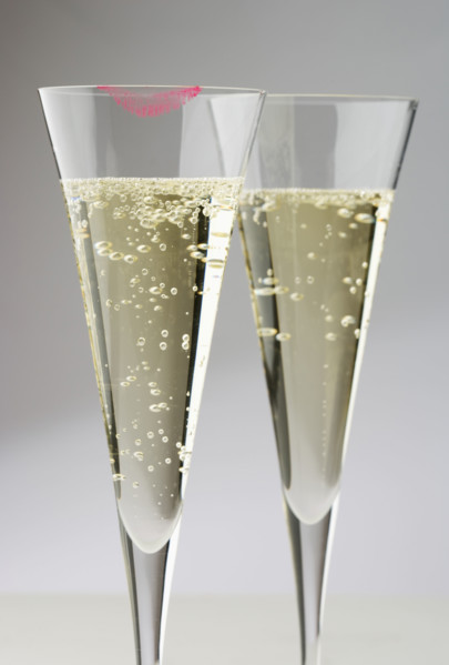 Champagne glasses with lipstick print.