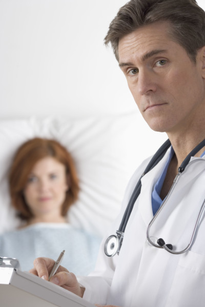 Doctor visiting with patient.