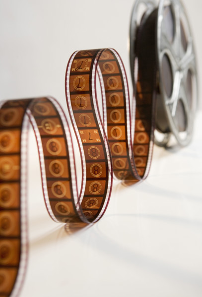 Movie film reel unrolling.