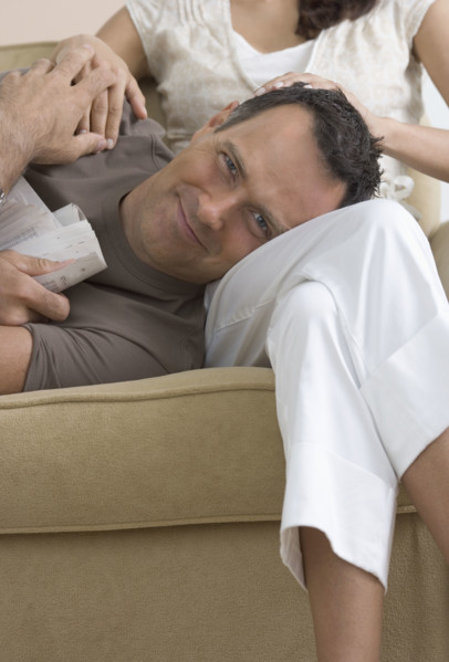 Man resting head on woman's lap.