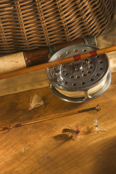 Still life of antique fishing reels.