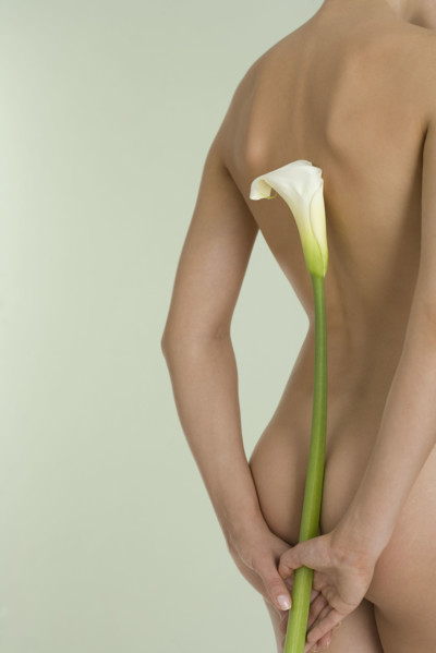 Nude female with calla lily.