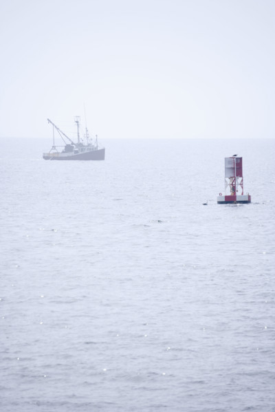Lobster boat in fog off the Maine coast.