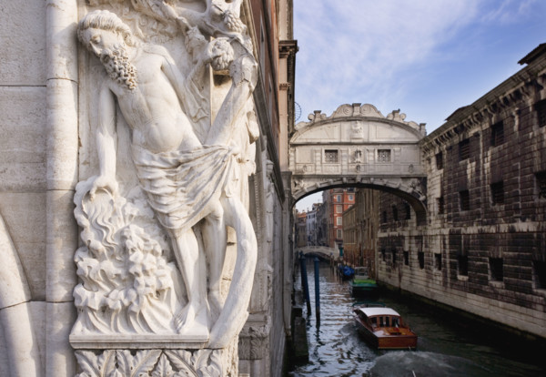 The Bridge of Sighs with sculpture depicting Drunkenness of Noah Doge's Palace Venice, Italy.