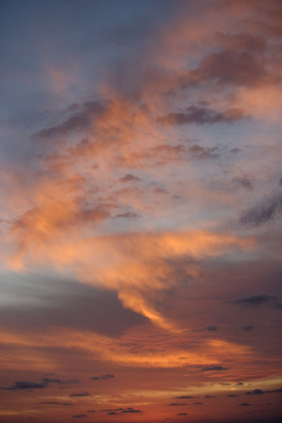 Sunlight from behind clouds.