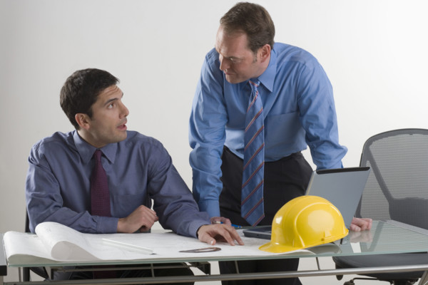 Two contractors in a meeting.