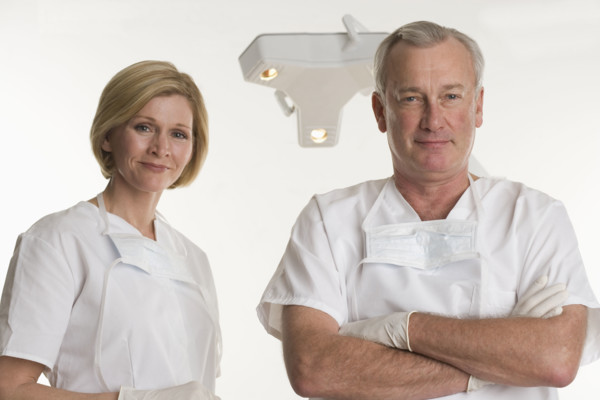 Portrait of dentist with dental hygienist.