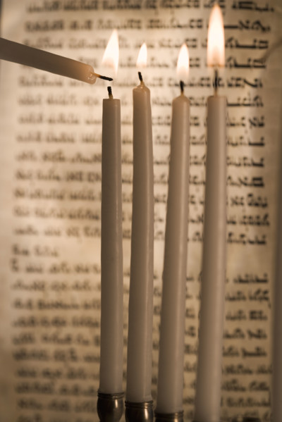 Lighting a menorah.