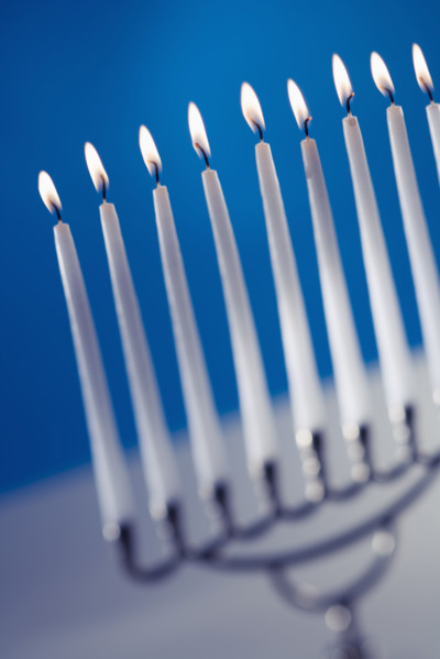A fully lit menorah.