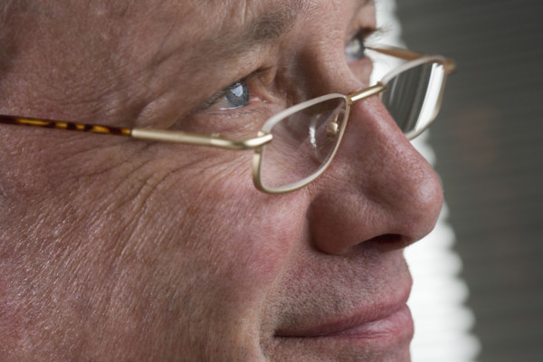 Portrait of man with glasses.