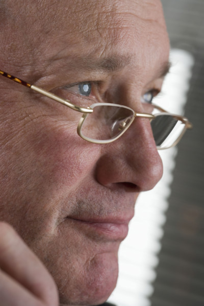Portrait of man with glasses.