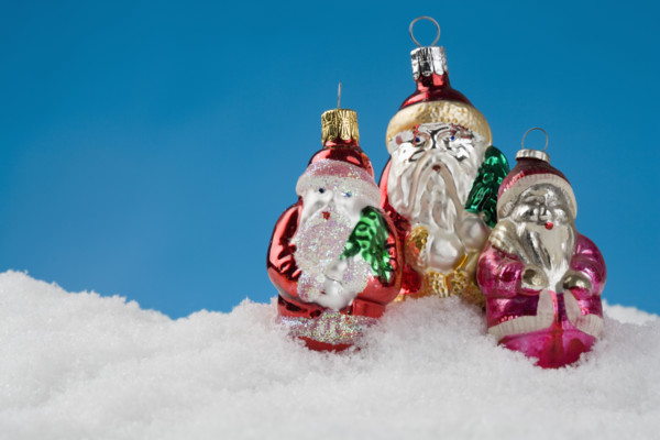 Three Santa Claus Christmas ornanaments.