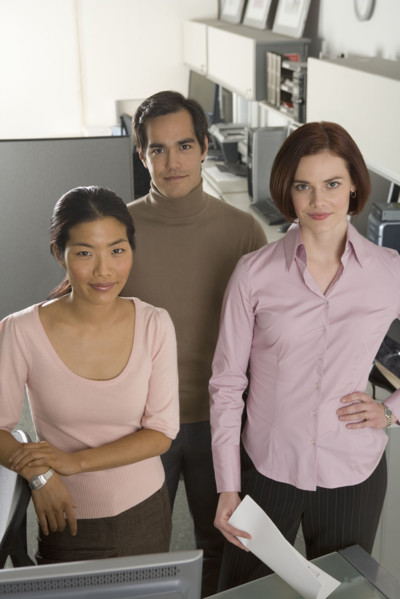 Portrait of three office workers.
