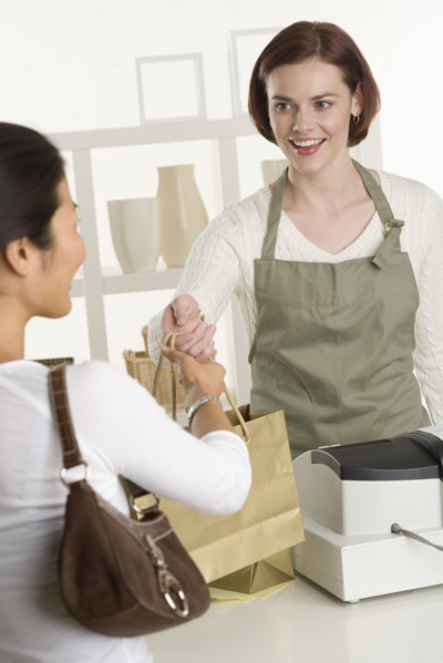 Shopkeeper with customer.