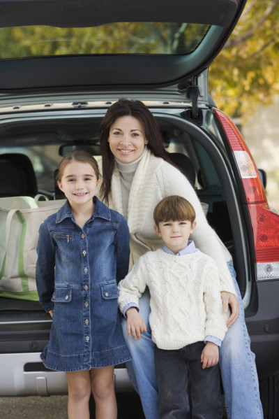 Portrait of mother with son and daughter.