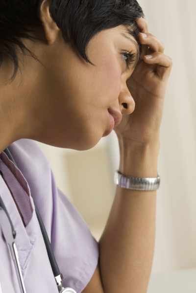 Profile view of a female health practitioner.