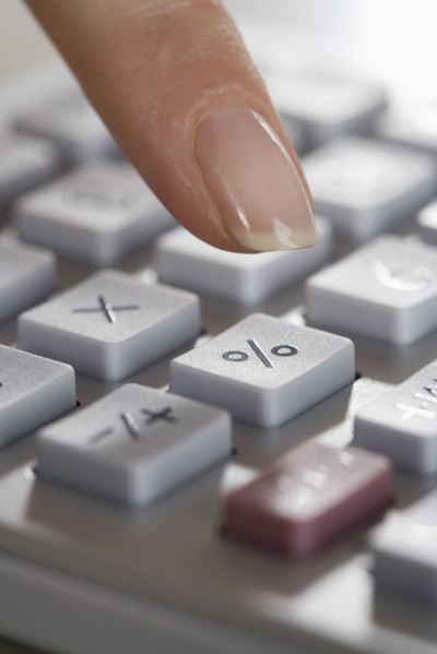 Woman using a calculator.