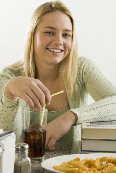 Young woman having a quick meal.