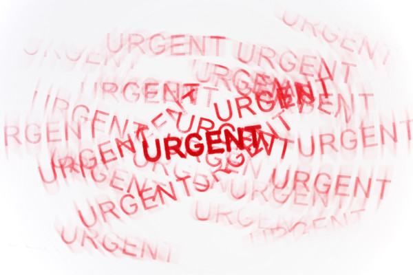 Studio shot of Urgent stamp.