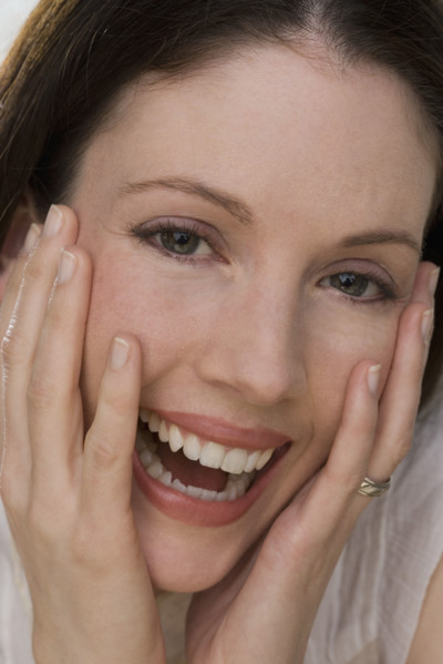 Close up of woman laughing.