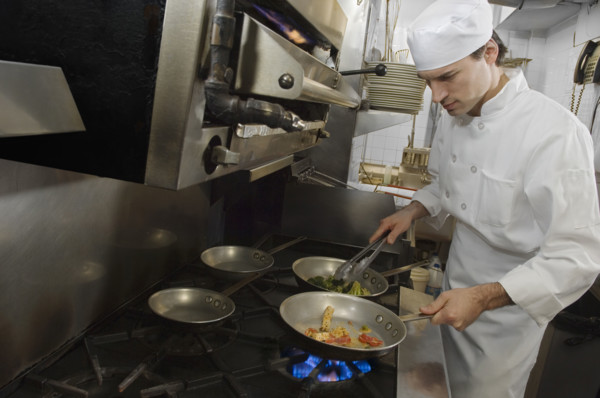 Male chef in restaurant kitchen.