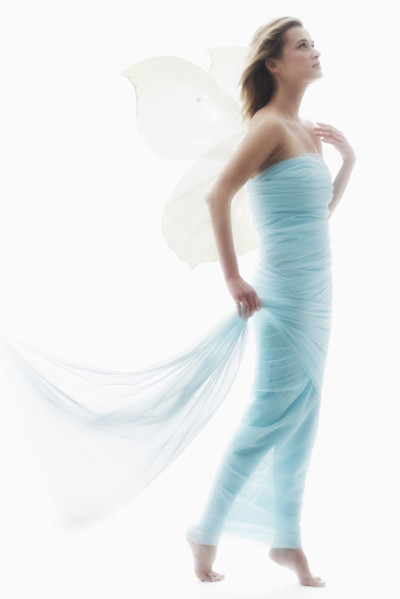 Young woman in full length gown.