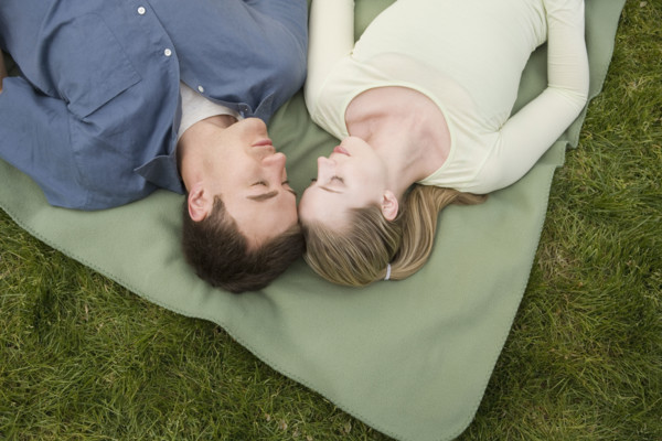Young couple relaxing outdoors.