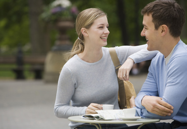 Couple having coffee at outdoor café.