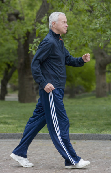 Senior man power walking.