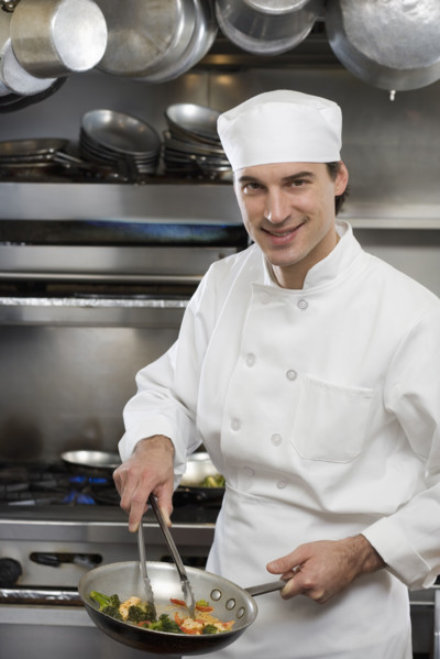 Male chef in restaurant kitchen.