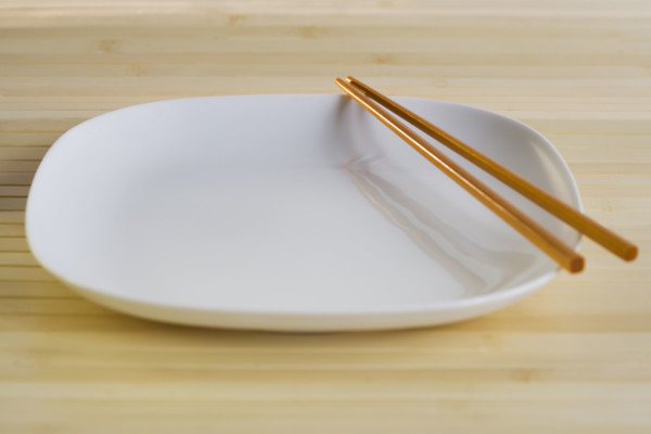 Close up of plate with chopsticks.