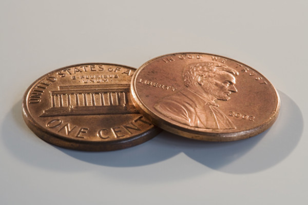 Close up of two pennies.