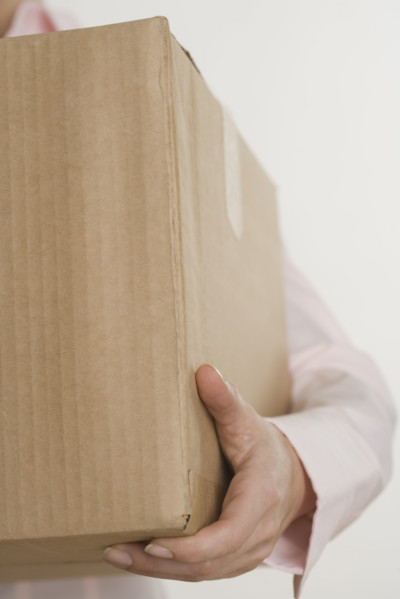 Woman carrying a box.