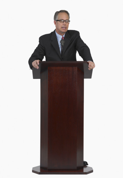 Businessman speaking at podium.