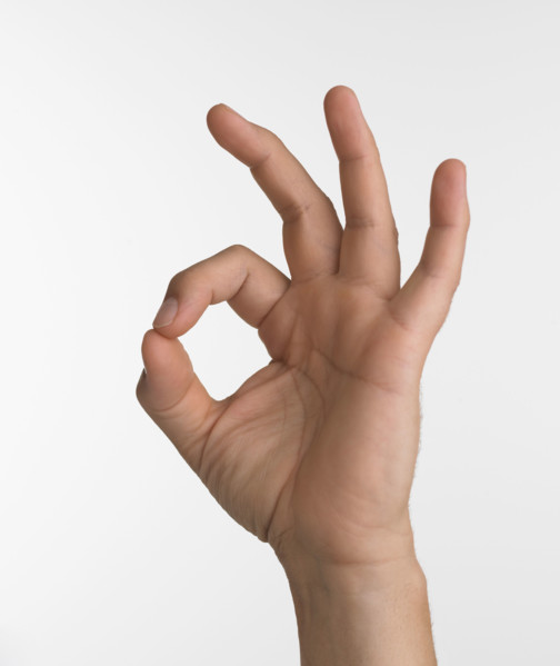 Studio shot of hand giving the okay sign.