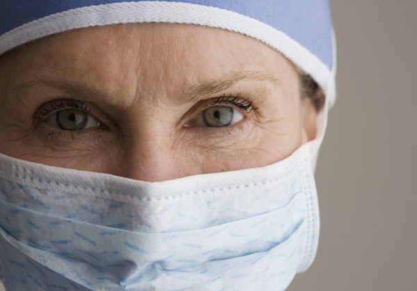 Close up of female doctor wearing surgical mask.