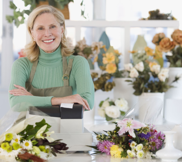 Portrait of female florist at cash register.
