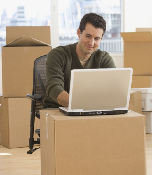 Businessman working in new office.