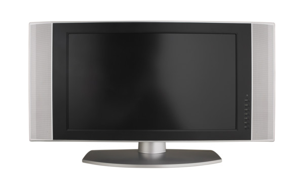 Wide screen television on table.