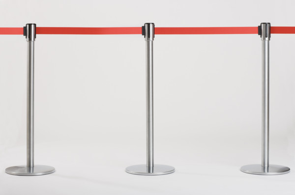 Studio shot of retractable belt crowd control barriers.